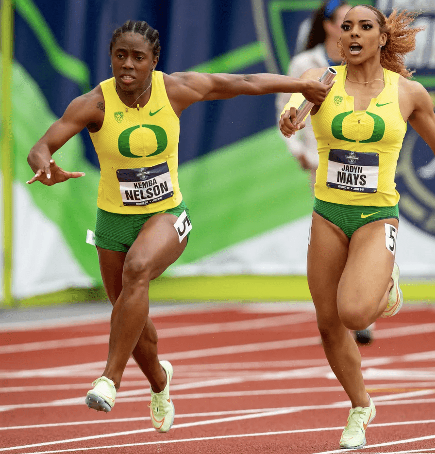 Oregon Kemba Nelson Receiving baton from teammate at the Baton from teammate in the 4x100m race at the ncaa championships