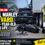 Three-vehicle collision involving a motorcycle, black Honda CR-V and heavy truck on Michael Manley Boulevard in Kingston, Jamaica.