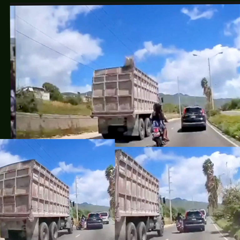 fatal three-vehicle collision on Michael Manley Boulevard in Kingston on October 12, 2026. The incident involved a motorcycle, a black Honda CR-V and a heavy truck